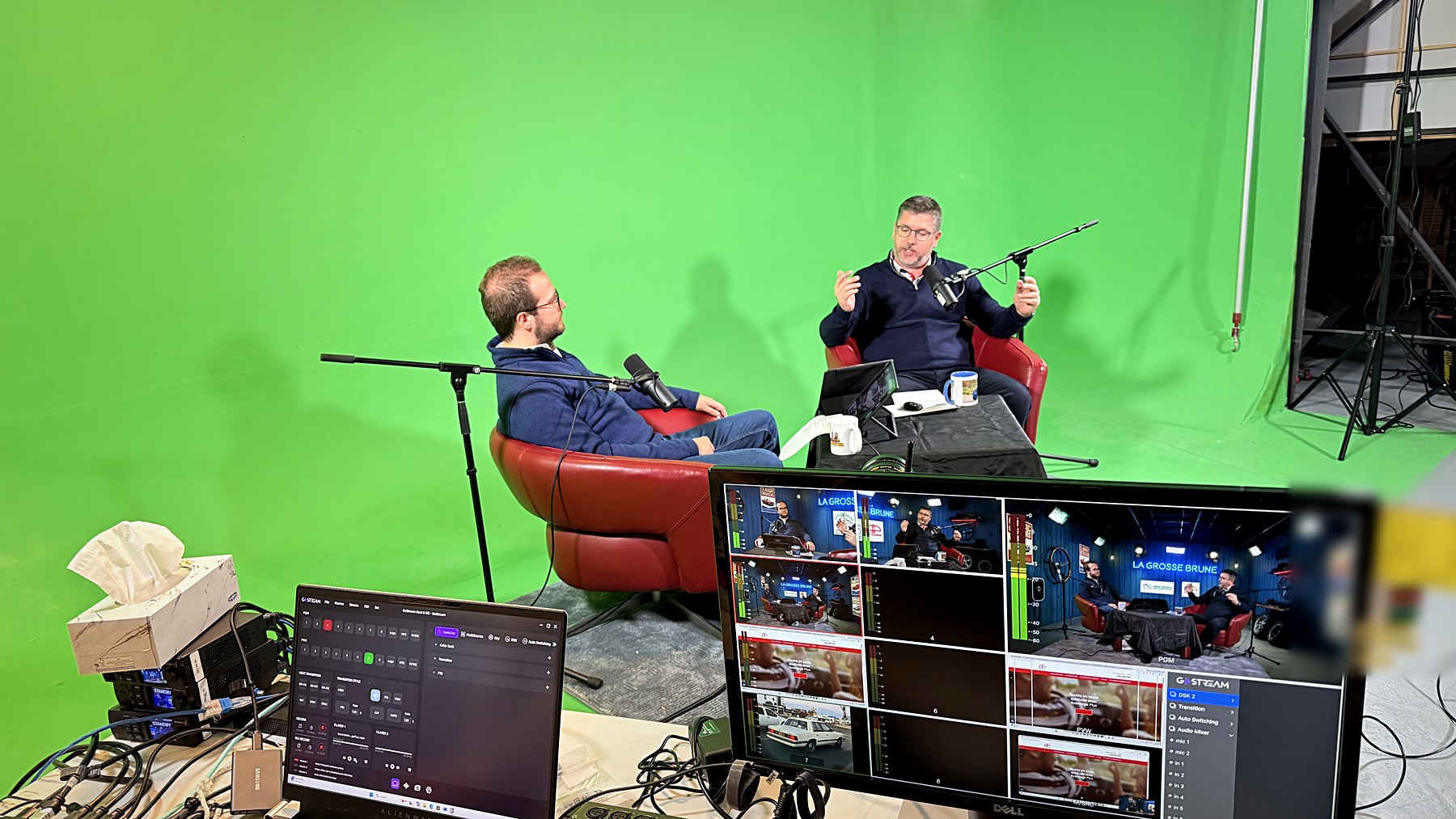 Behind the scenes: the same set on green screen, with the control position